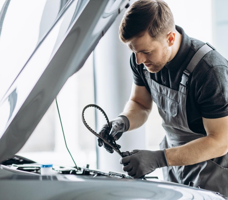 Car mechanic polishing car before painting 1.jpg